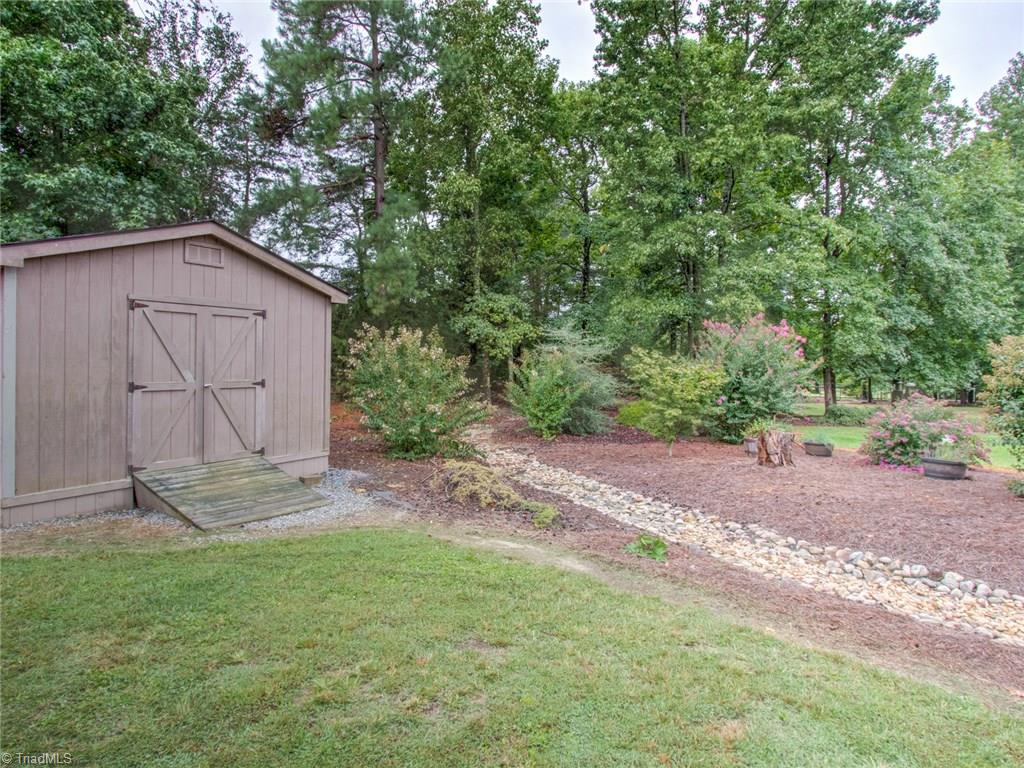 6001 Dunvagen Court Oak Ridge, NC 27310 - Photo 28 of 30 Storage buildings remain with the property.