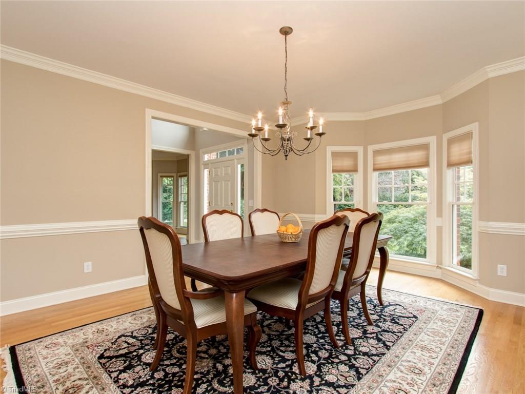 6001 Dunvagen Court Oak Ridge, NC 27310 - Photo 4 of 30 Generous sized Dining Room with bay window, chairrail and crown moldings...