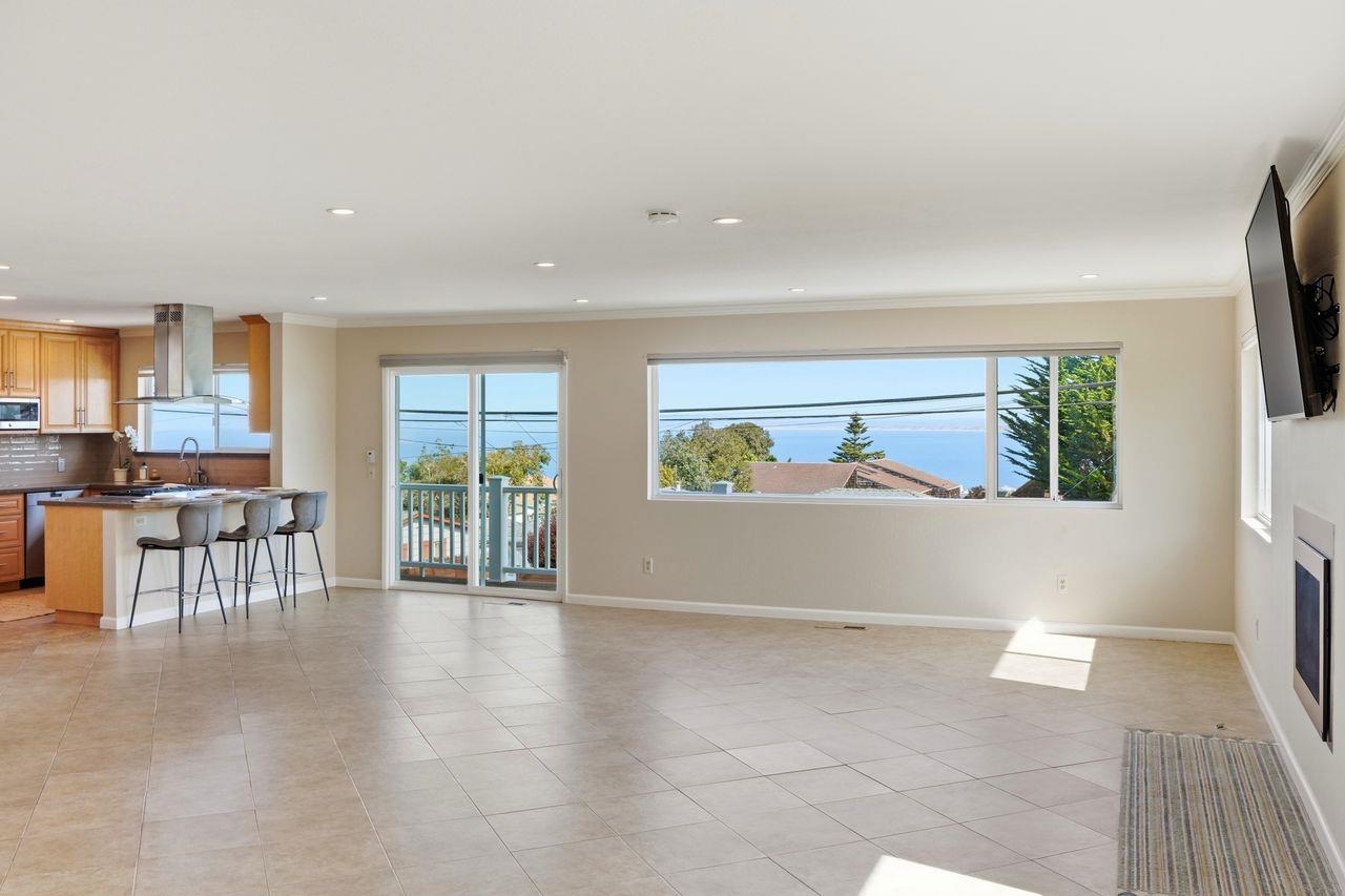 701 Archer Street Monterey, CA 93940 - Photo 10 of 39 a view of an empty room with furniture and a window