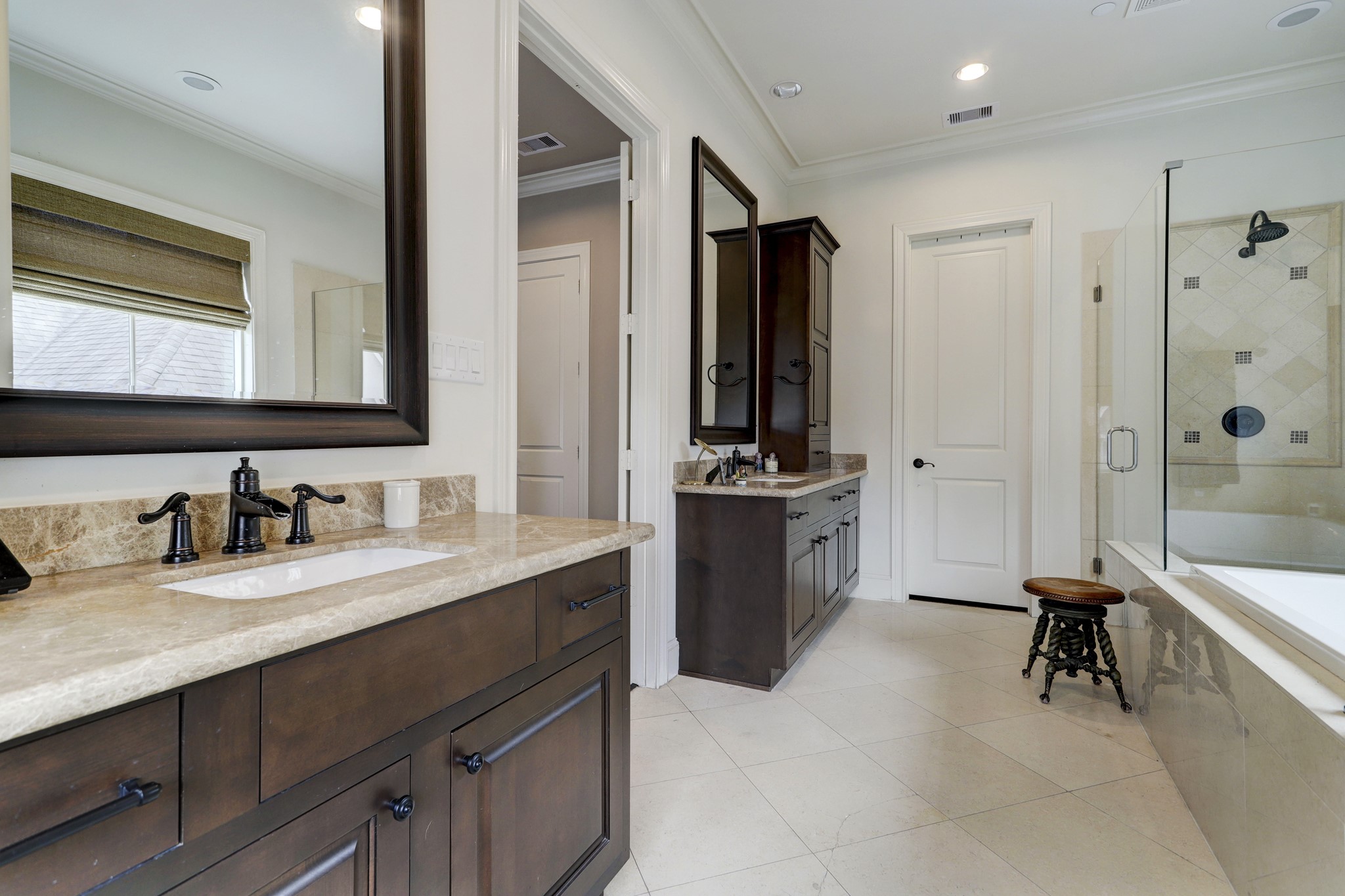 5218 Crawford Street Houston, TX 77004 - Photo 8 of 22 Primary bath featuring a spa tub, separate his/hers vanities, large shower, and separate water closet.