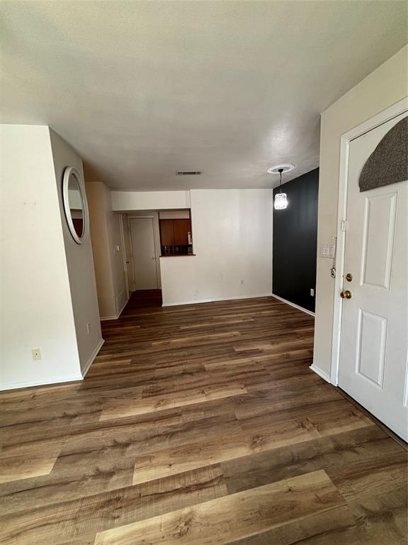 1500 Lake Shore Drive, Unit 213 Waco, TX 76708 - Photo 17 of 21 a view of empty room with wooden floor