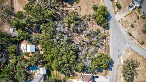 a view of a house with a tree