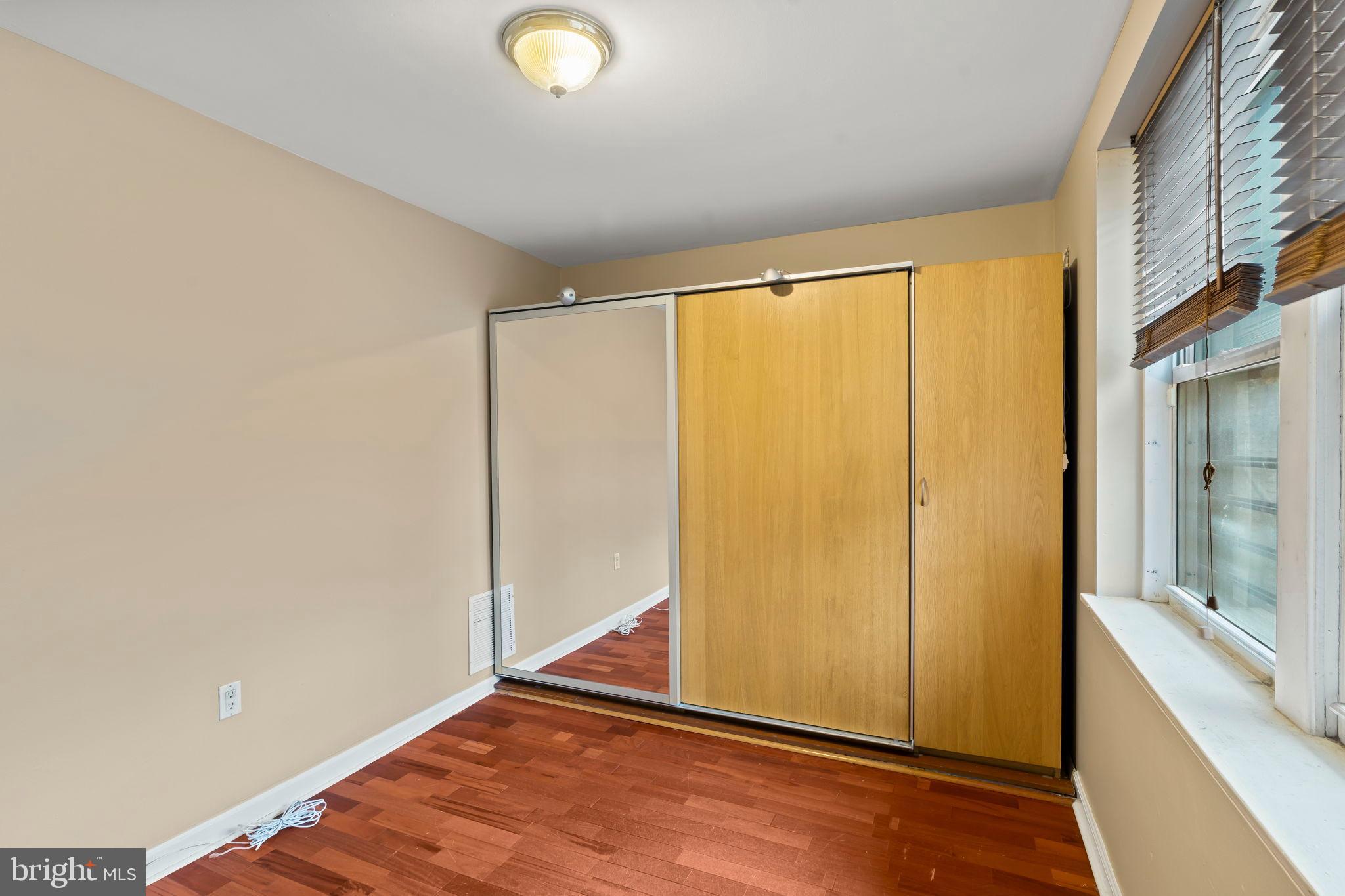 1828-00 Green Street, Unit 1R Philadelphia, PA 19130 - Photo 13 of 37 a view of a room with wooden floor