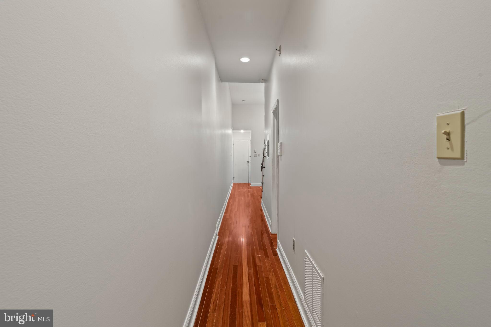 1828-00 Green Street, Unit 1R Philadelphia, PA 19130 - Photo 17 of 37 a view of a hallway with wooden floor