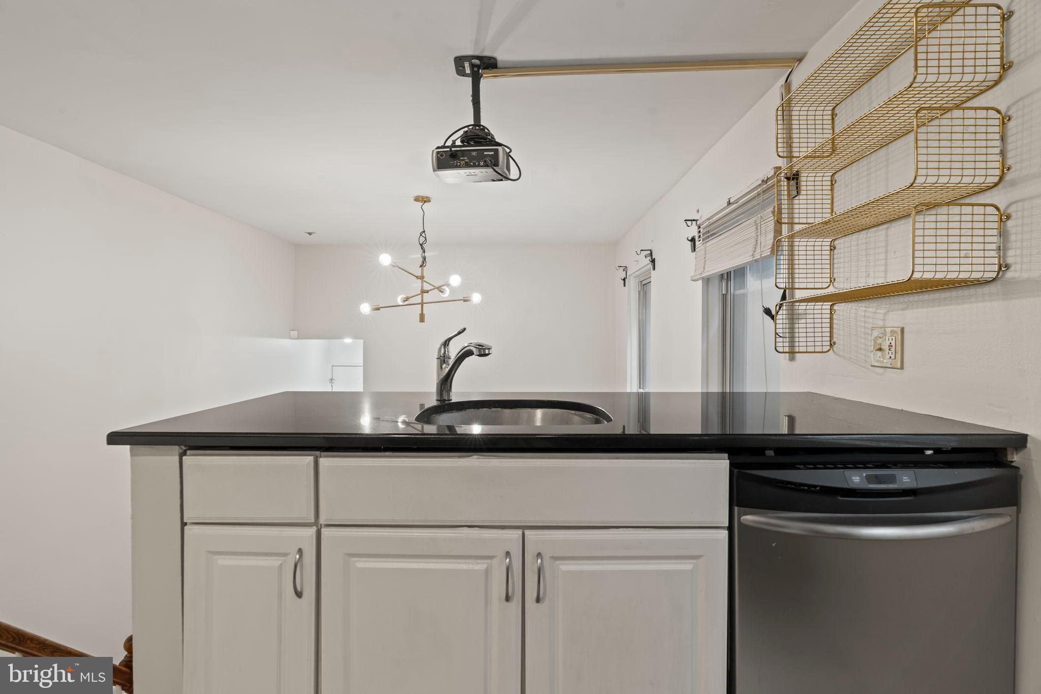 1828-00 Green Street, Unit 1R Philadelphia, PA 19130 - Photo 23 of 37 a kitchen with a sink and a refrigerator