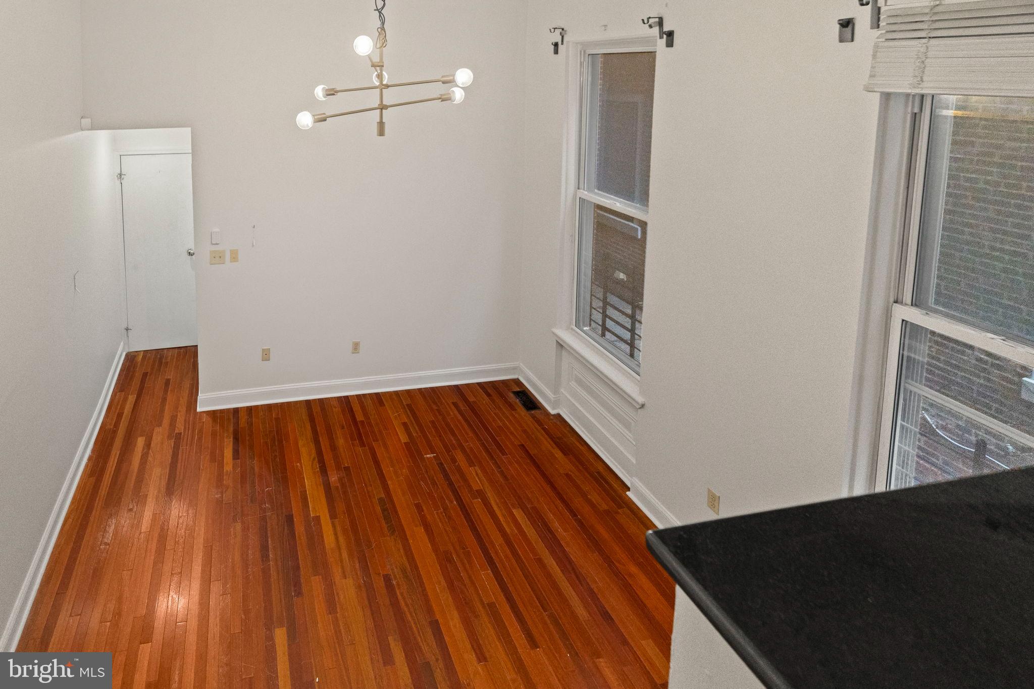 1828-00 Green Street, Unit 1R Philadelphia, PA 19130 - Photo 24 of 37 a view of room with wooden floor and ceiling fan