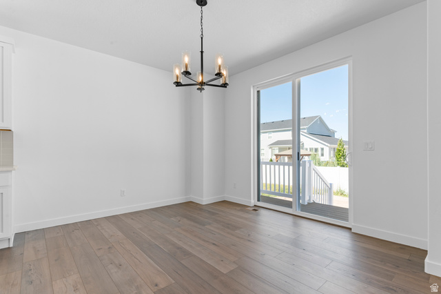 3016 West 2650 North Clinton, UT 84015 - Photo 14 of 20 Unfurnished dining area with suspended lighting and dark wood finished floors