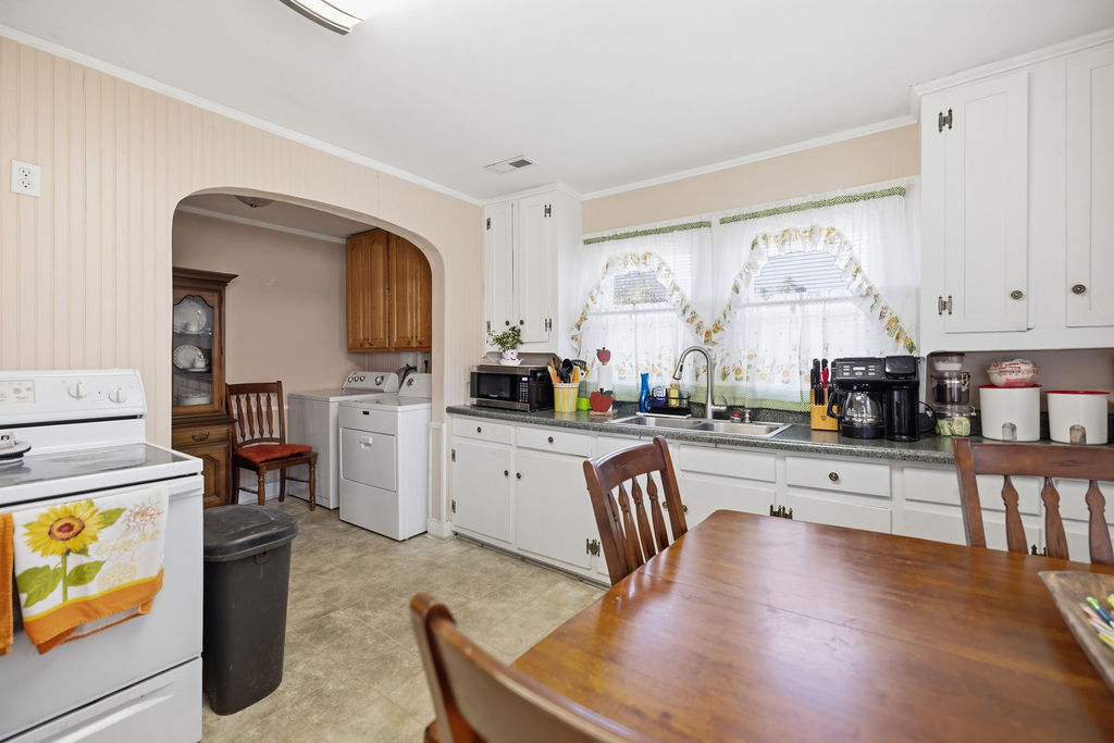 3212 Dixon Road Anderson, SC 29625 - Photo 16 of 23 This spacious kitchen offers a functional layout, with ample cabinetry and generous counter space.