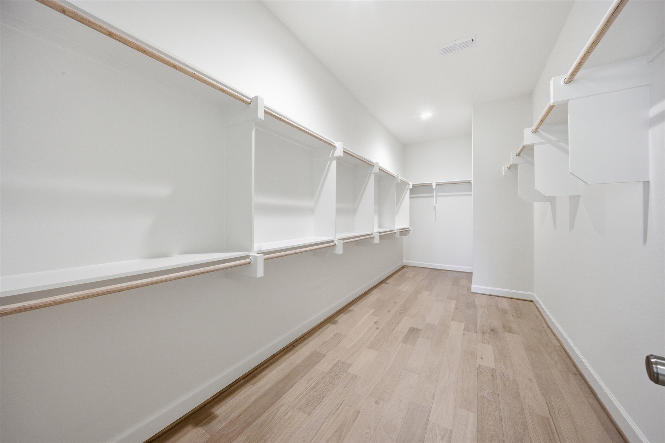 416 Venado View Court Conroe, TX 77304 - Photo 17 of 34 Large walk-in closet with extensive hanging space, organization, and room for a luxury boutique-style wardrobe experience.