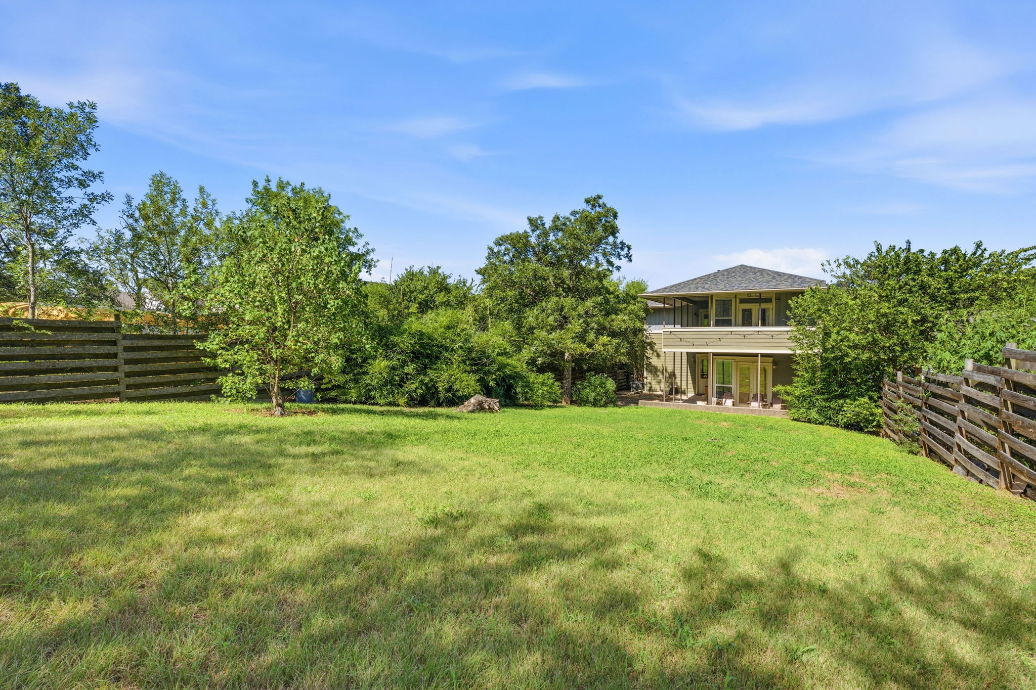 1305 Cometa Street Austin, TX 78721 - Photo 24 of 28 A spacious backyard provides ample green space for outdoor activities and future enhancements.