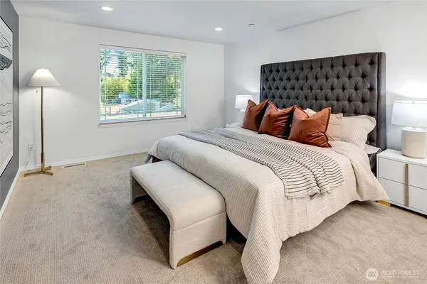 a bedroom with bed and window