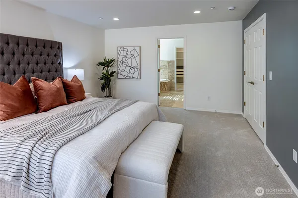 a bed room with a bed and a couch