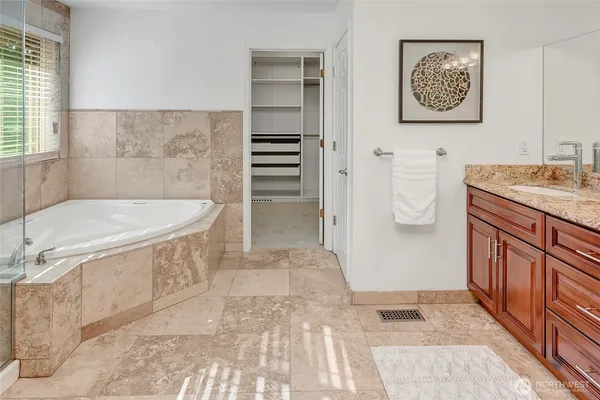 a bathroom with a sink a toilet and bathtub