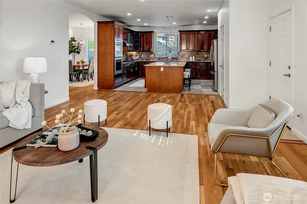 a living room with furniture and kitchen view
