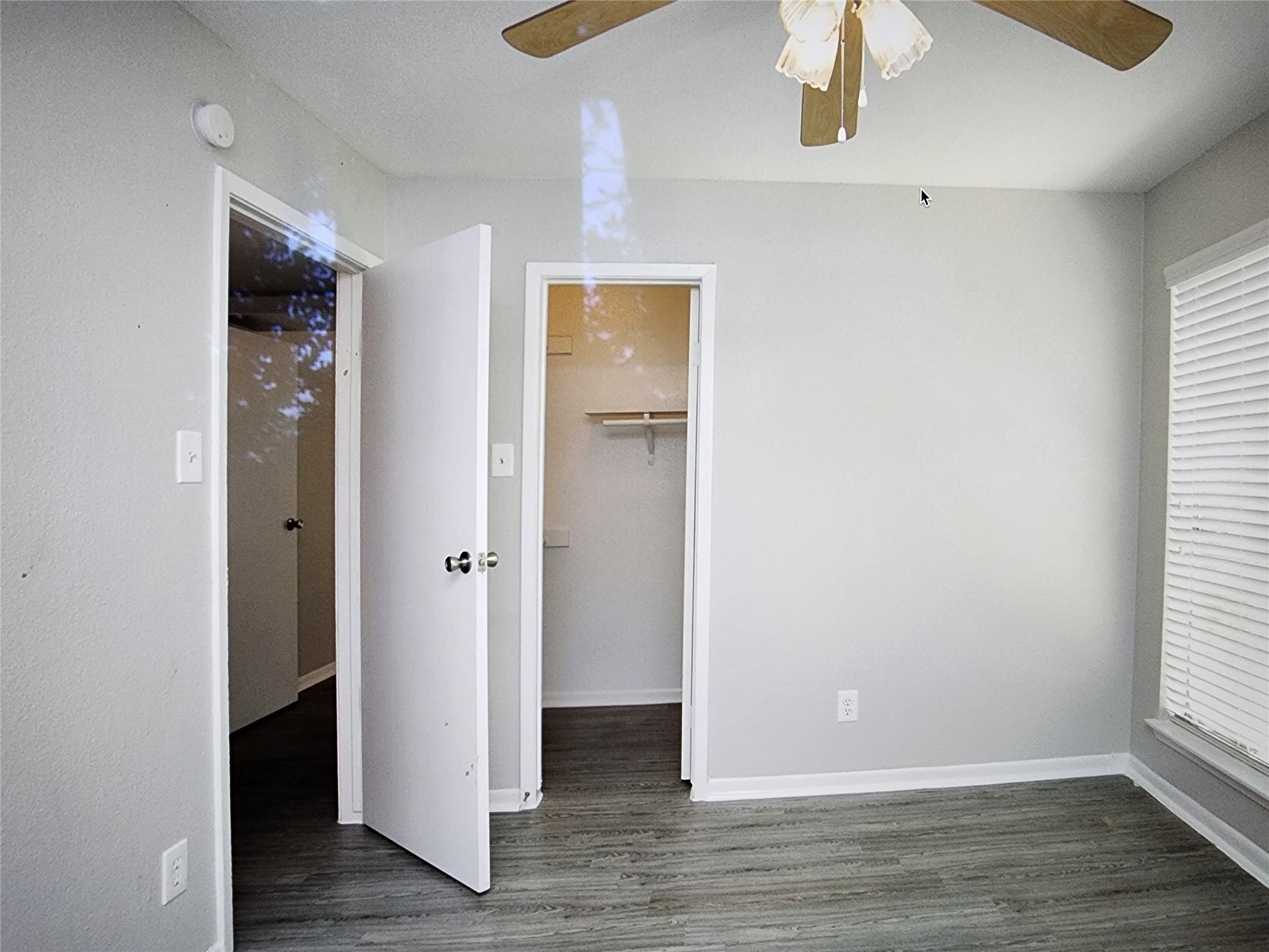 2402 Bammelwood Drive, Unit 226 Houston, TX 77014 - Photo 8 of 8 a view of an empty room with wooden floor and a window