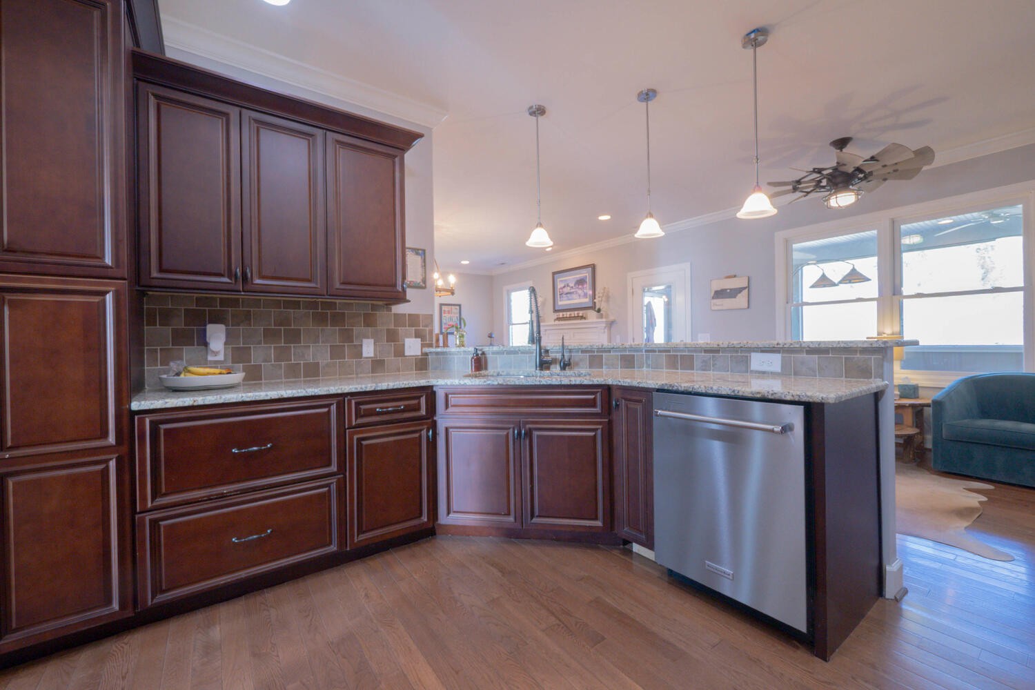 5125 Old Harding Road Franklin, TN 37064 - Photo 15 of 50 a kitchen with kitchen island granite countertop wooden cabinets and white appliances