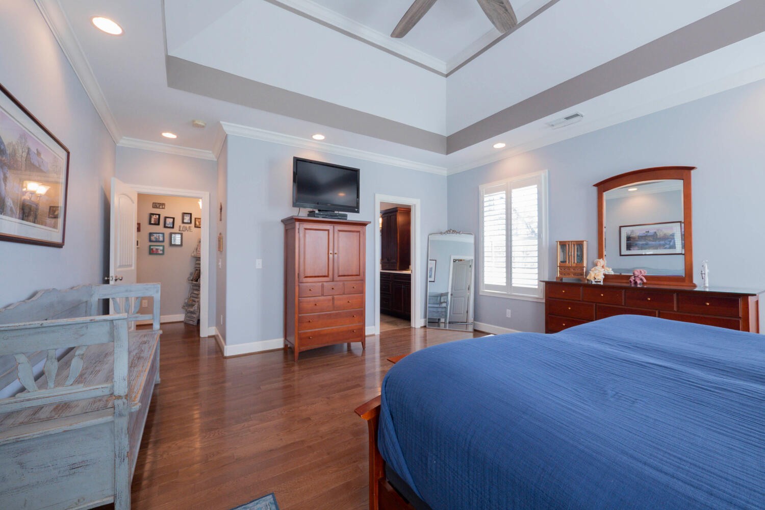 5125 Old Harding Road Franklin, TN 37064 - Photo 23 of 50 a large bedroom with a bed and a flat screen tv