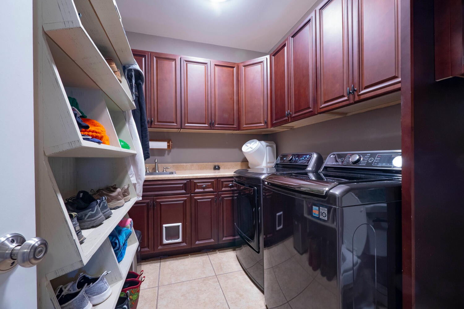 5125 Old Harding Road Franklin, TN 37064 - Photo 32 of 50 a kitchen with a sink a stove and cabinets