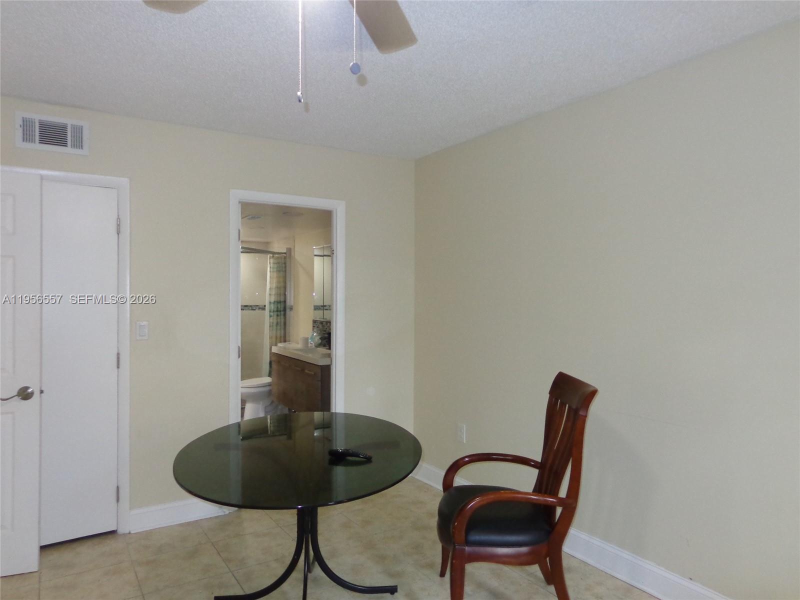 4172 Inverrary Drive, Unit 110 Lauderhill, FL 33319 - Photo 12 of 25 a view of a room with a table and chairs