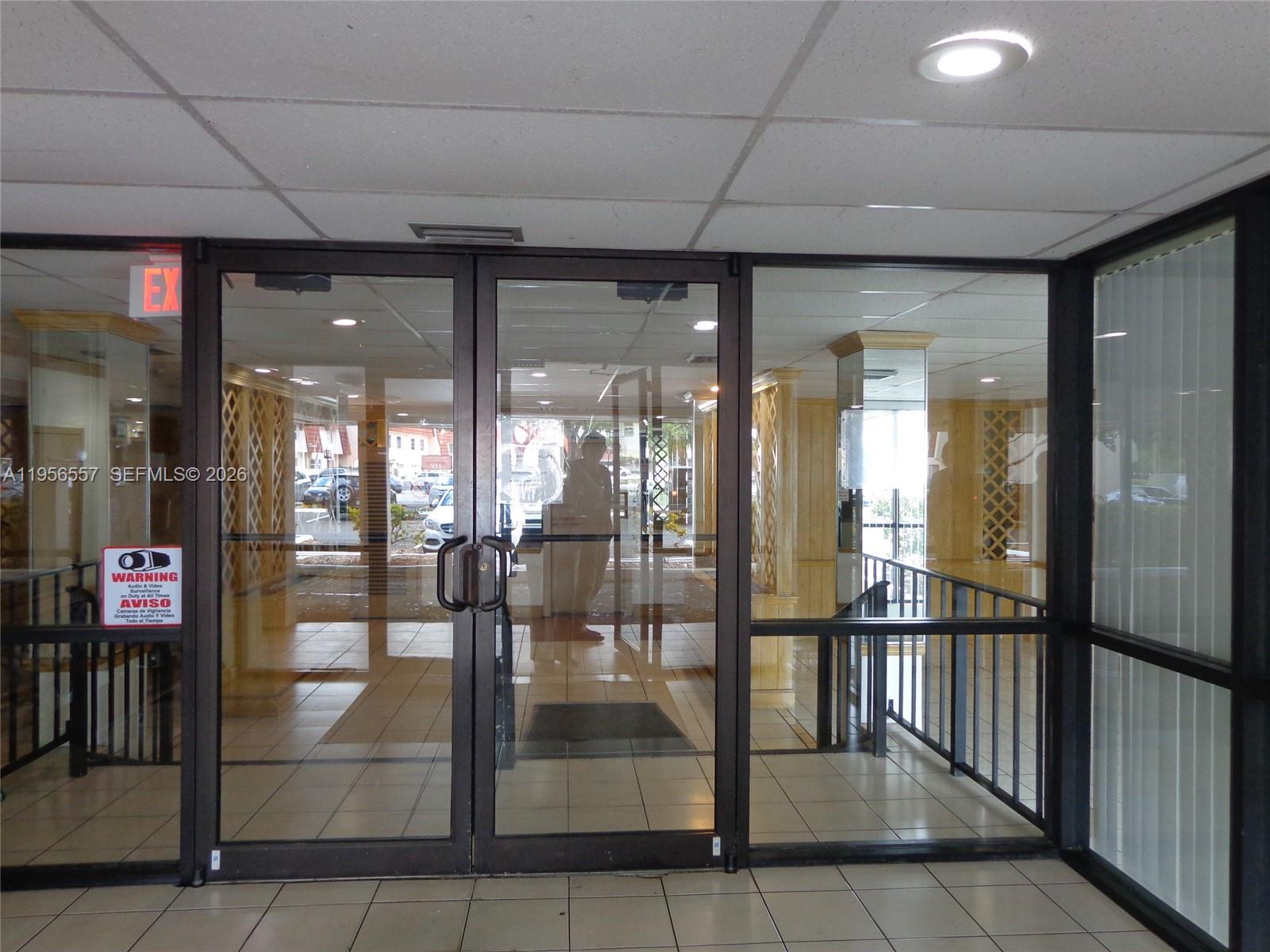 4172 Inverrary Drive, Unit 110 Lauderhill, FL 33319 - Photo 21 of 25 a view of a living room and chandelier