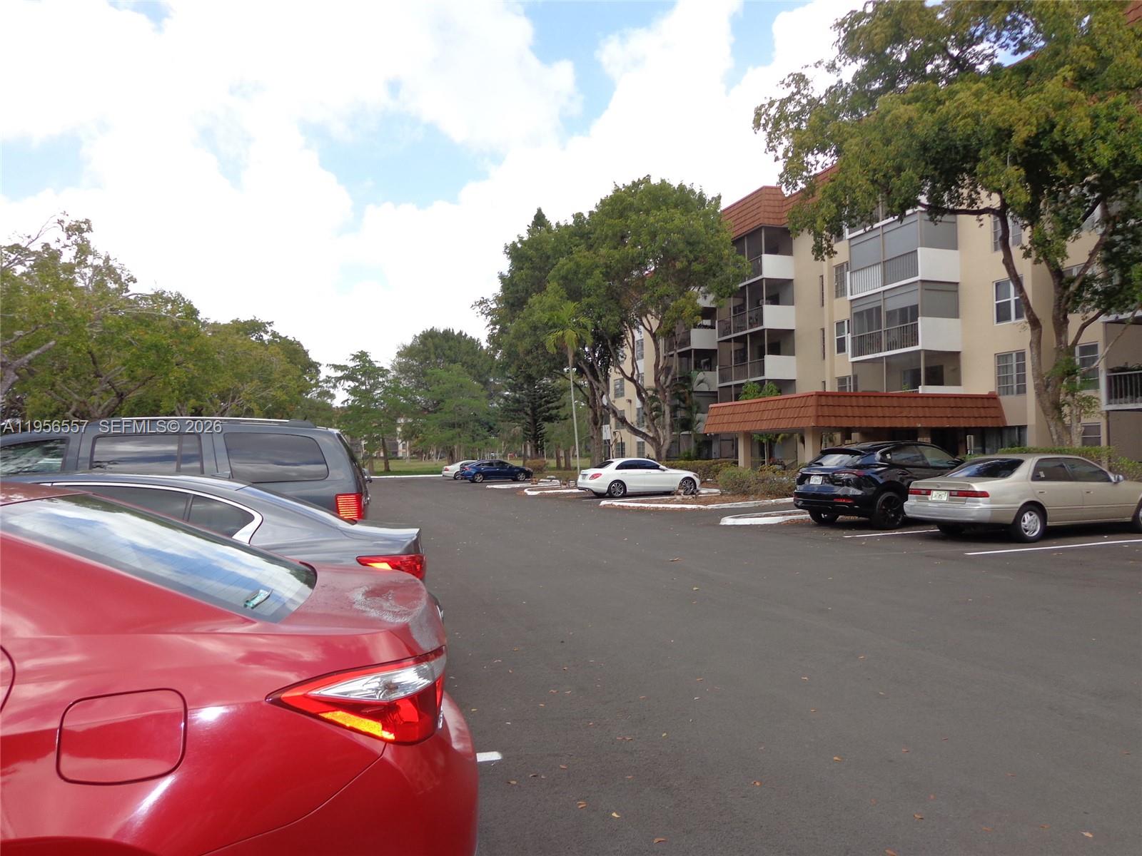4172 Inverrary Drive, Unit 110 Lauderhill, FL 33319 - Photo 24 of 25 a car parked on the side of the road
