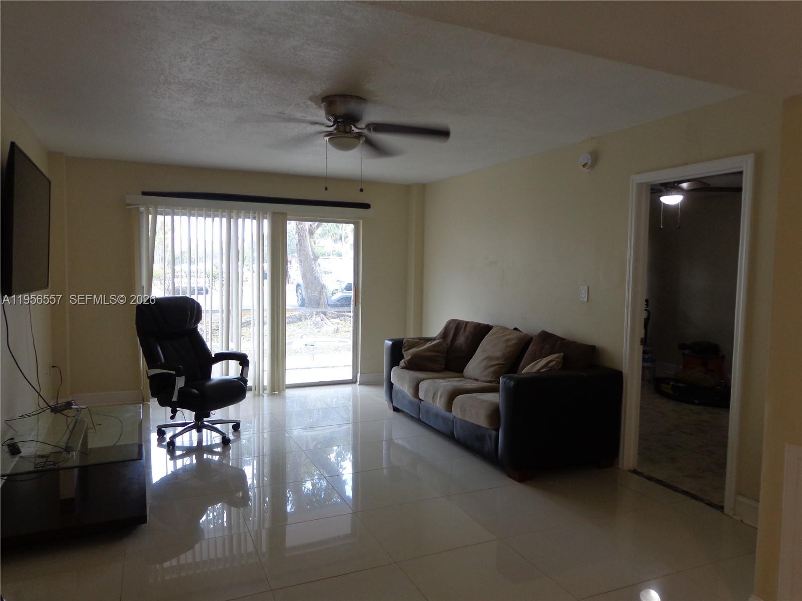 4172 Inverrary Drive, Unit 110 Lauderhill, FL 33319 - Photo 10 of 25 a living room with furniture
