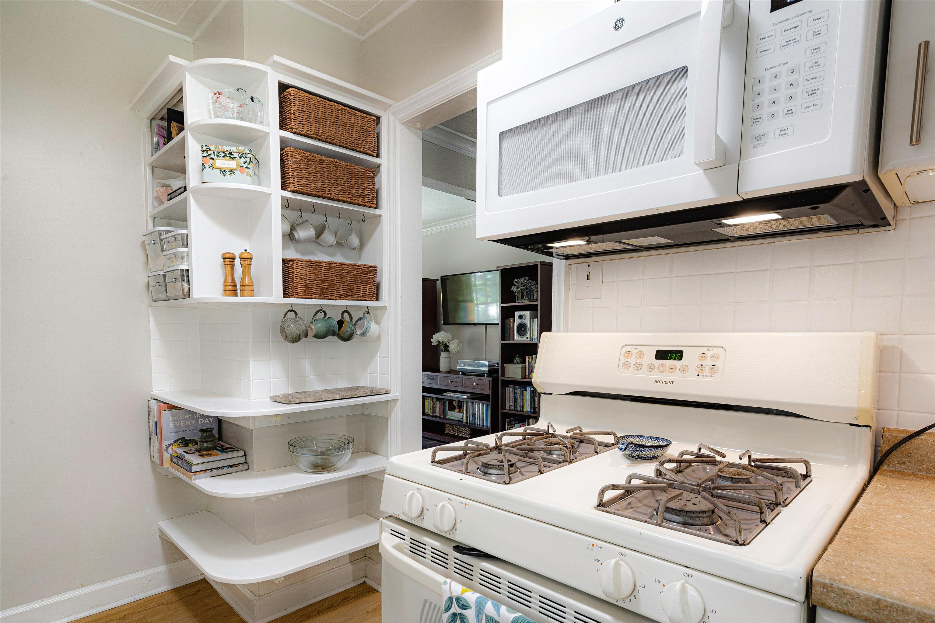 5019 Princeton Road Memphis, TN 38117 - Photo 11 of 25 a white stove top oven sitting inside of a kitchen