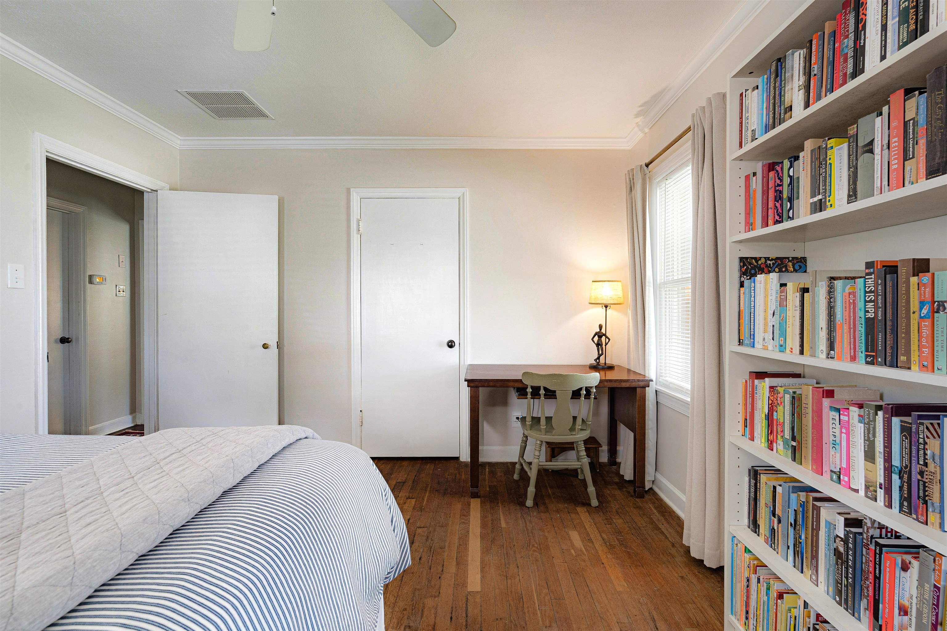 5019 Princeton Road Memphis, TN 38117 - Photo 20 of 25 a bedroom with a bed and a book shelf