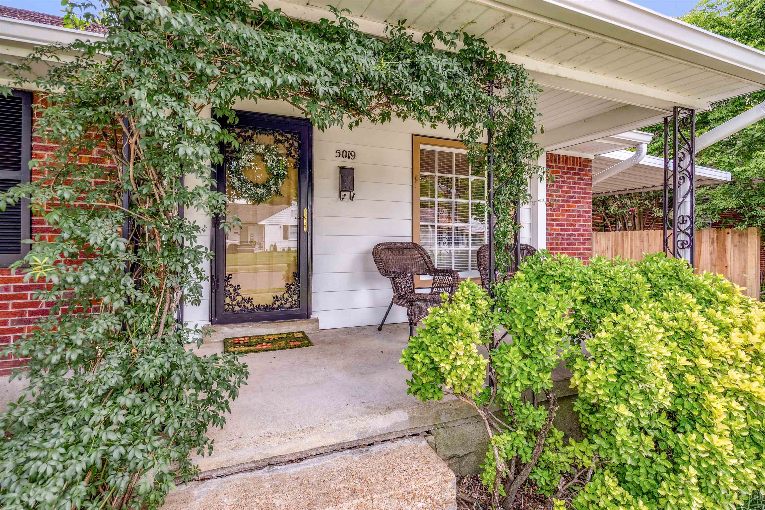 5019 Princeton Road Memphis, TN 38117 - Photo 2 of 25 a front view of a house with garden