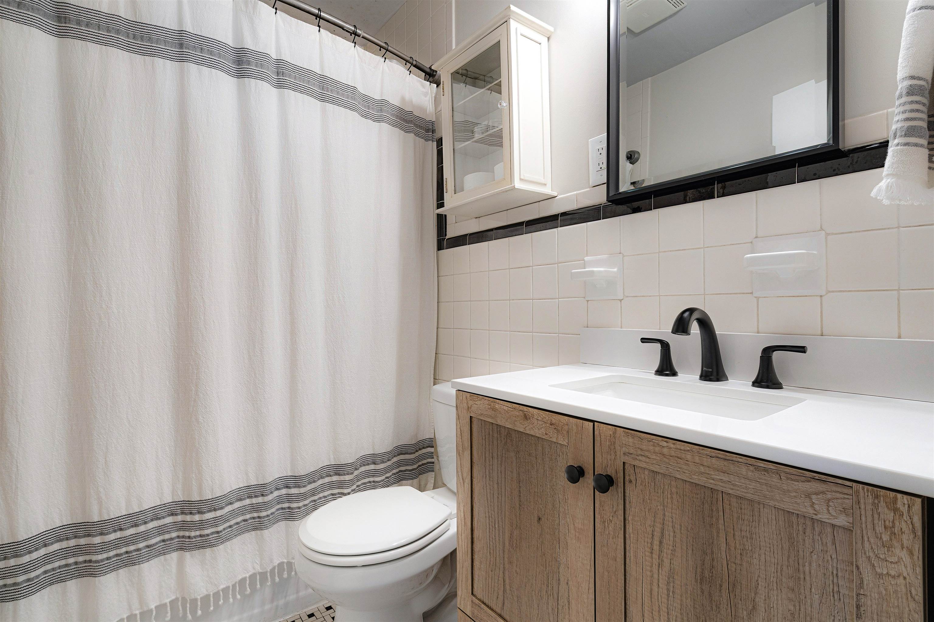 5019 Princeton Road Memphis, TN 38117 - Photo 21 of 25 a bathroom with a sink a toilet and a mirror