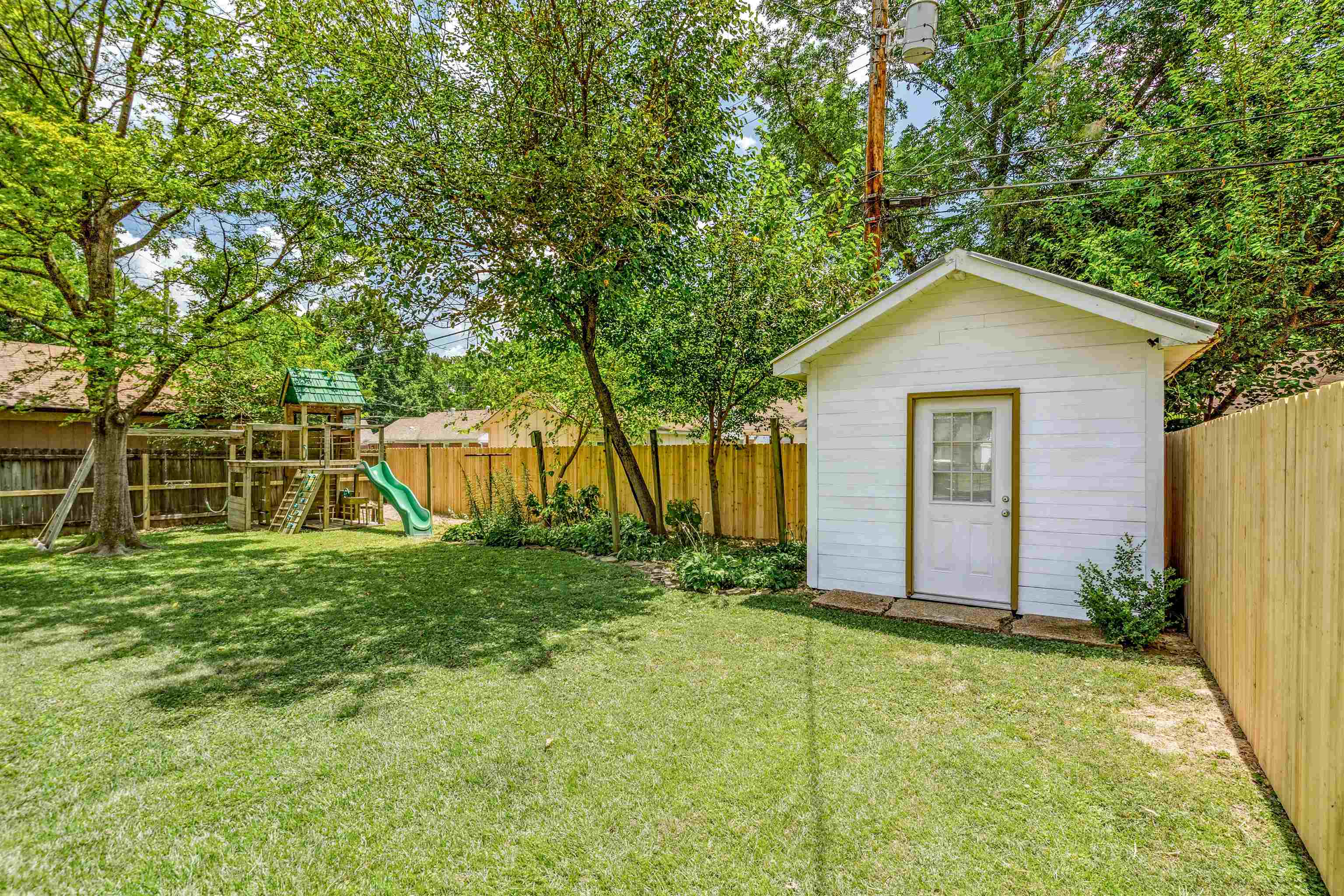 5019 Princeton Road Memphis, TN 38117 - Photo 25 of 25 a view of a house with backyard and garden