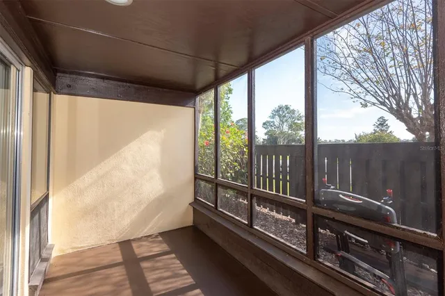 a view of a balcony with furniture