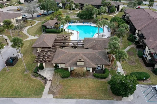 a view of a swimming pool with a yard