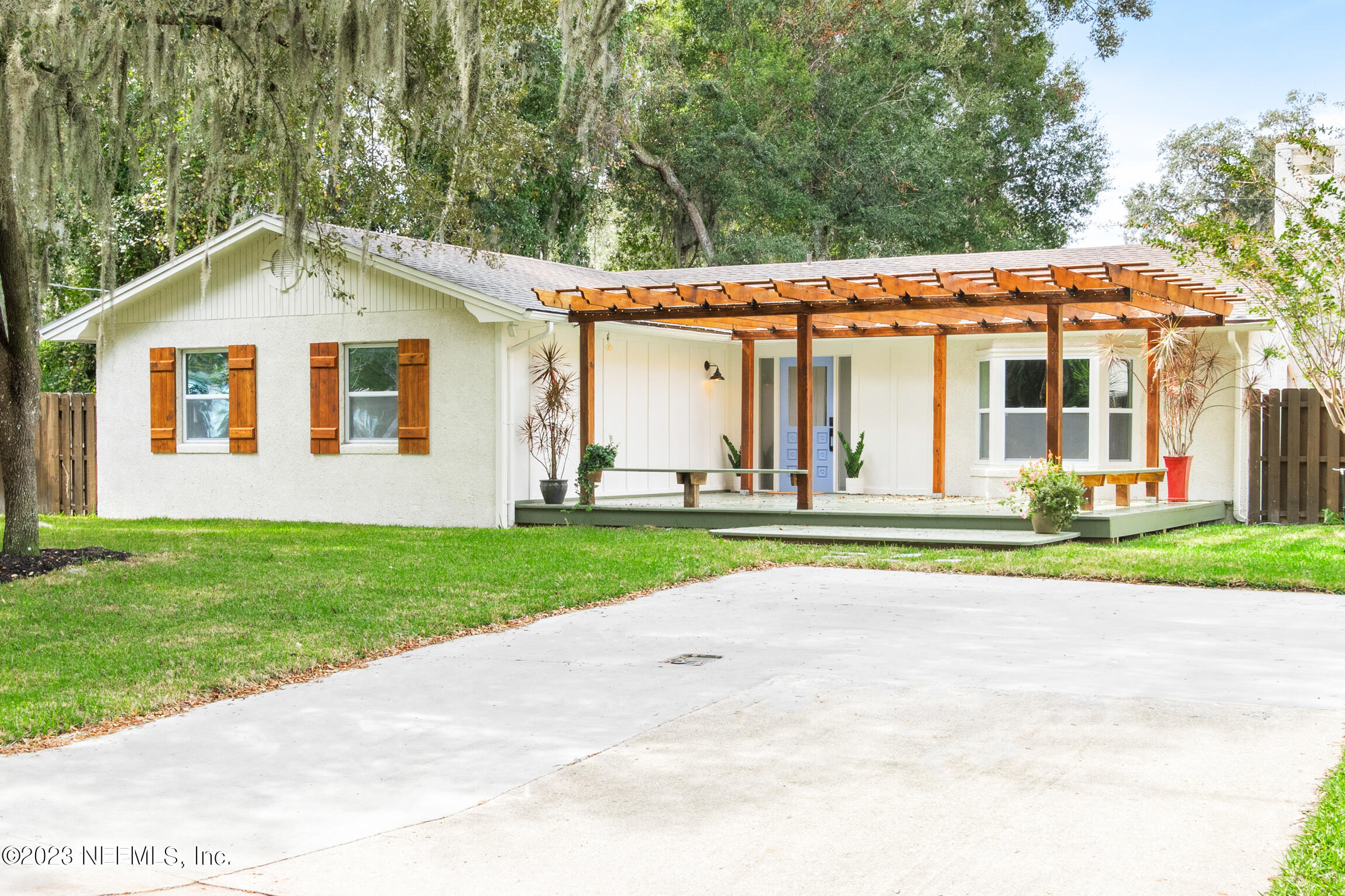 120 Hawthorne Road St. Augustine, FL 32086 - Photo 2 of 36 a view of a house with a yard and plants