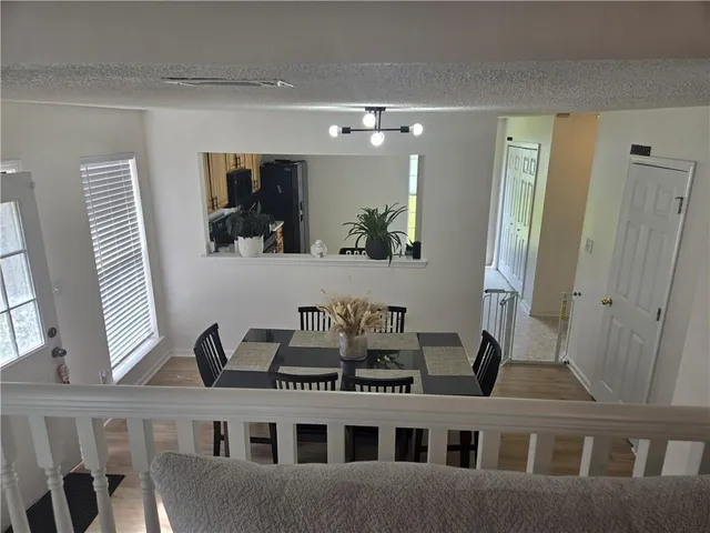 a view of a living room with furniture and a window