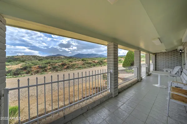 a view of balcony with furniture