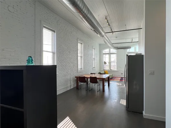 a view of dining room with furniture and window