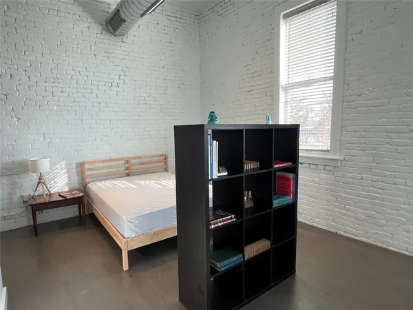 a bedroom with a bed and a closet