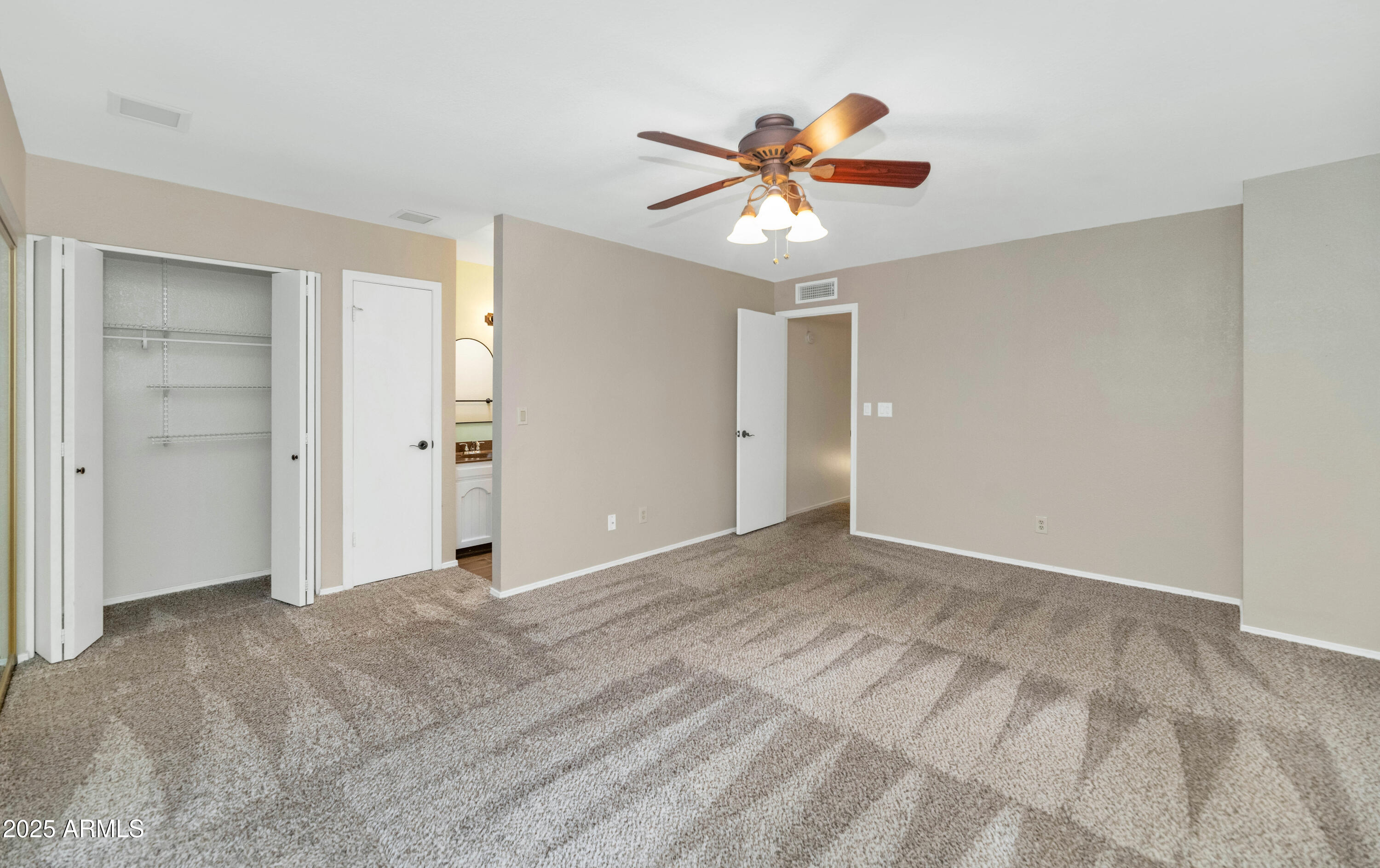5726 North 10th Street, Unit 5 Phoenix, AZ 85014 - Photo 11 of 39 a view of an empty room with window and closet area