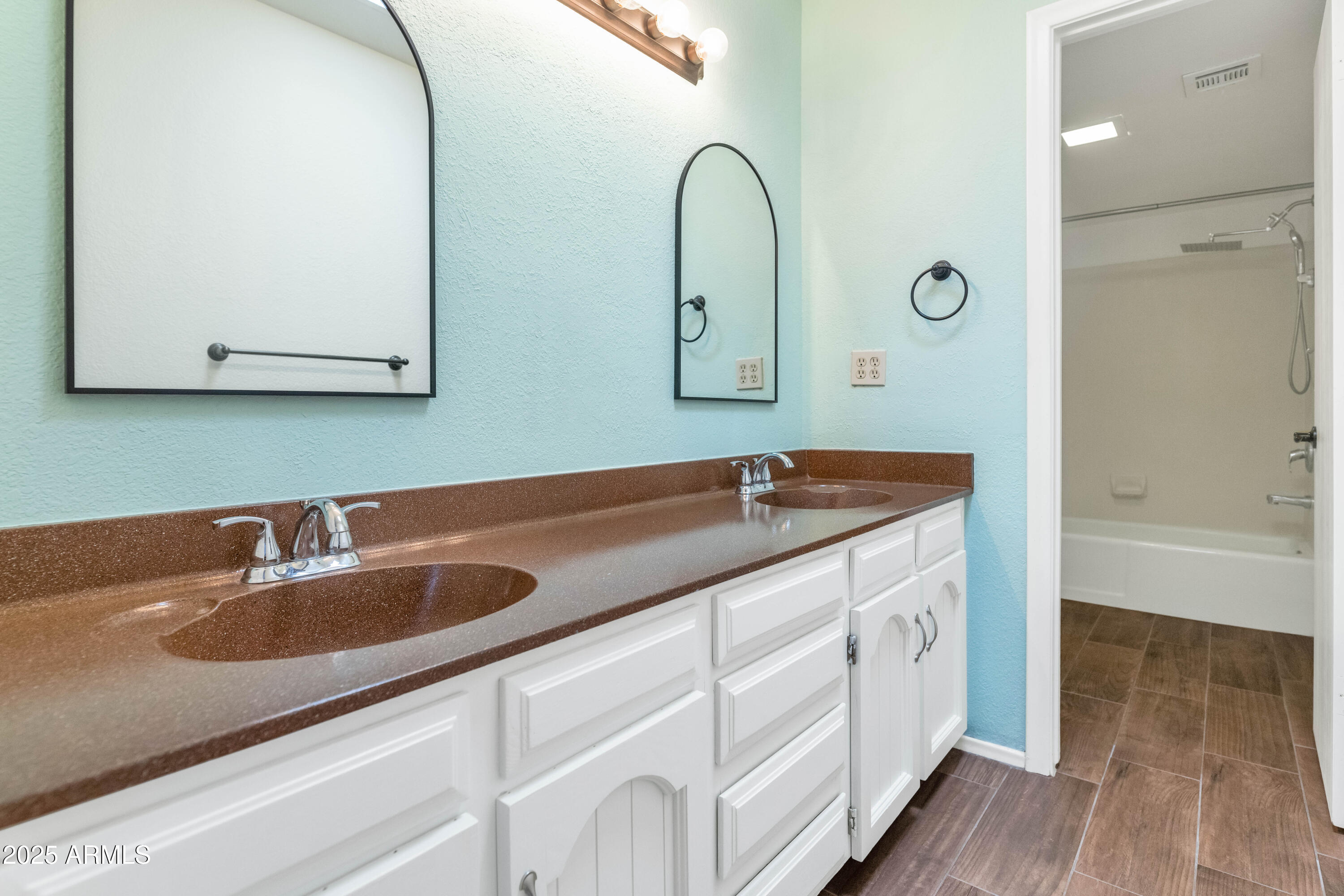 5726 North 10th Street, Unit 5 Phoenix, AZ 85014 - Photo 13 of 39 a bathroom with a double vanity sink and mirror