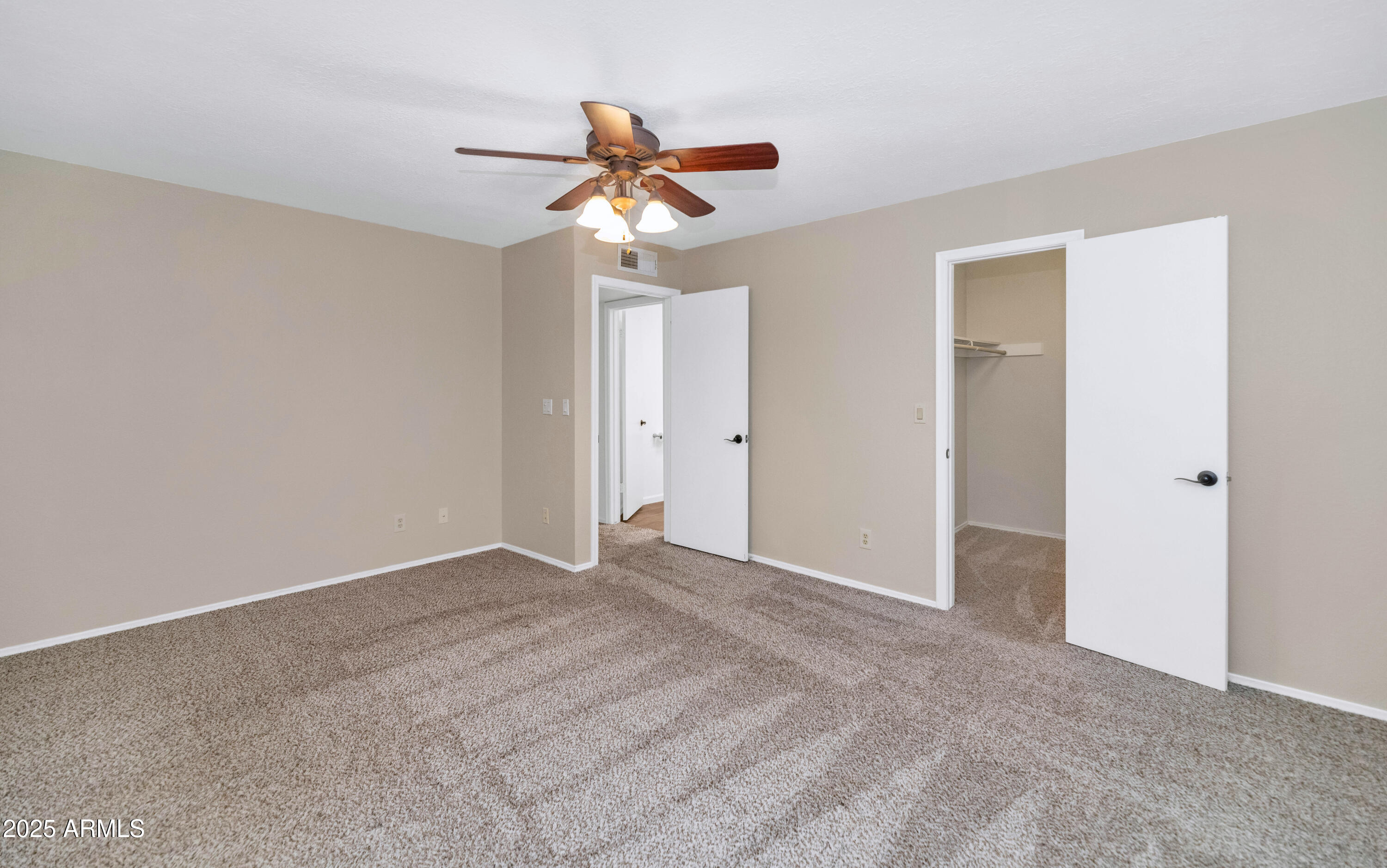 5726 North 10th Street, Unit 5 Phoenix, AZ 85014 - Photo 16 of 39 a view of an empty room with a fan