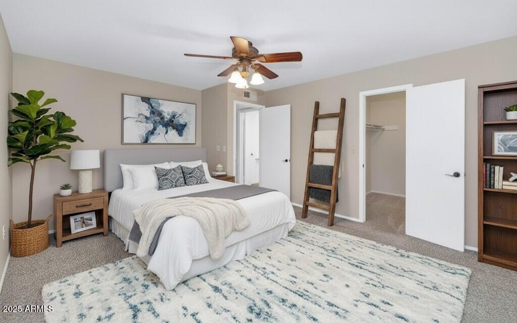 5726 North 10th Street, Unit 5 Phoenix, AZ 85014 - Photo 17 of 39 a bedroom with a large bed and a chandelier