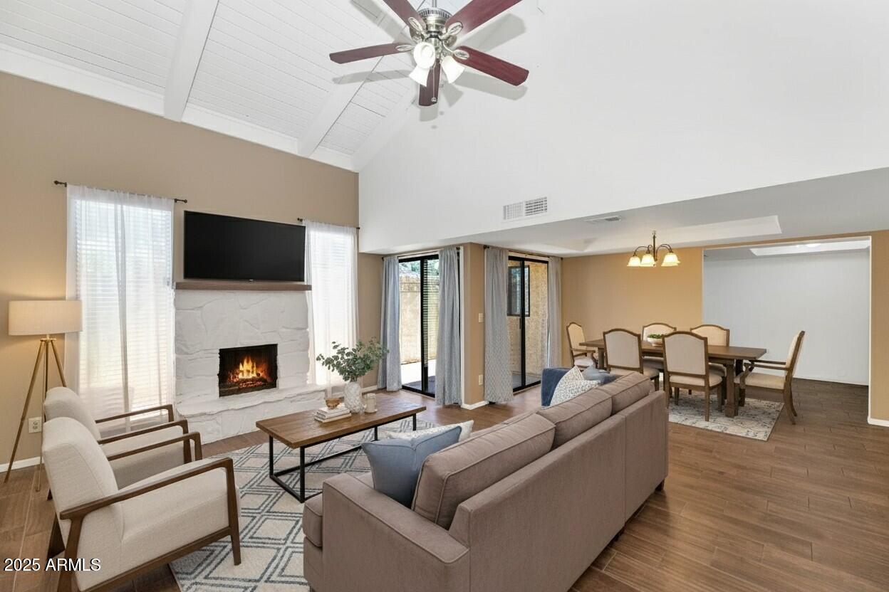 5726 North 10th Street, Unit 5 Phoenix, AZ 85014 - Photo 2 of 39 a living room with furniture a fireplace and a flat screen tv