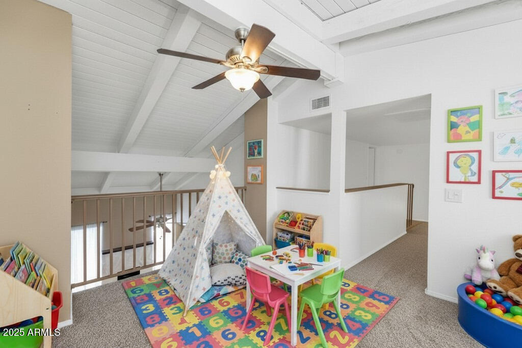5726 North 10th Street, Unit 5 Phoenix, AZ 85014 - Photo 21 of 39 a bedroom with furniture a baby crib lounge chair and a chandelier