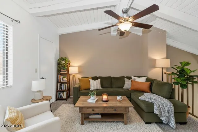 a living room with furniture and white walls