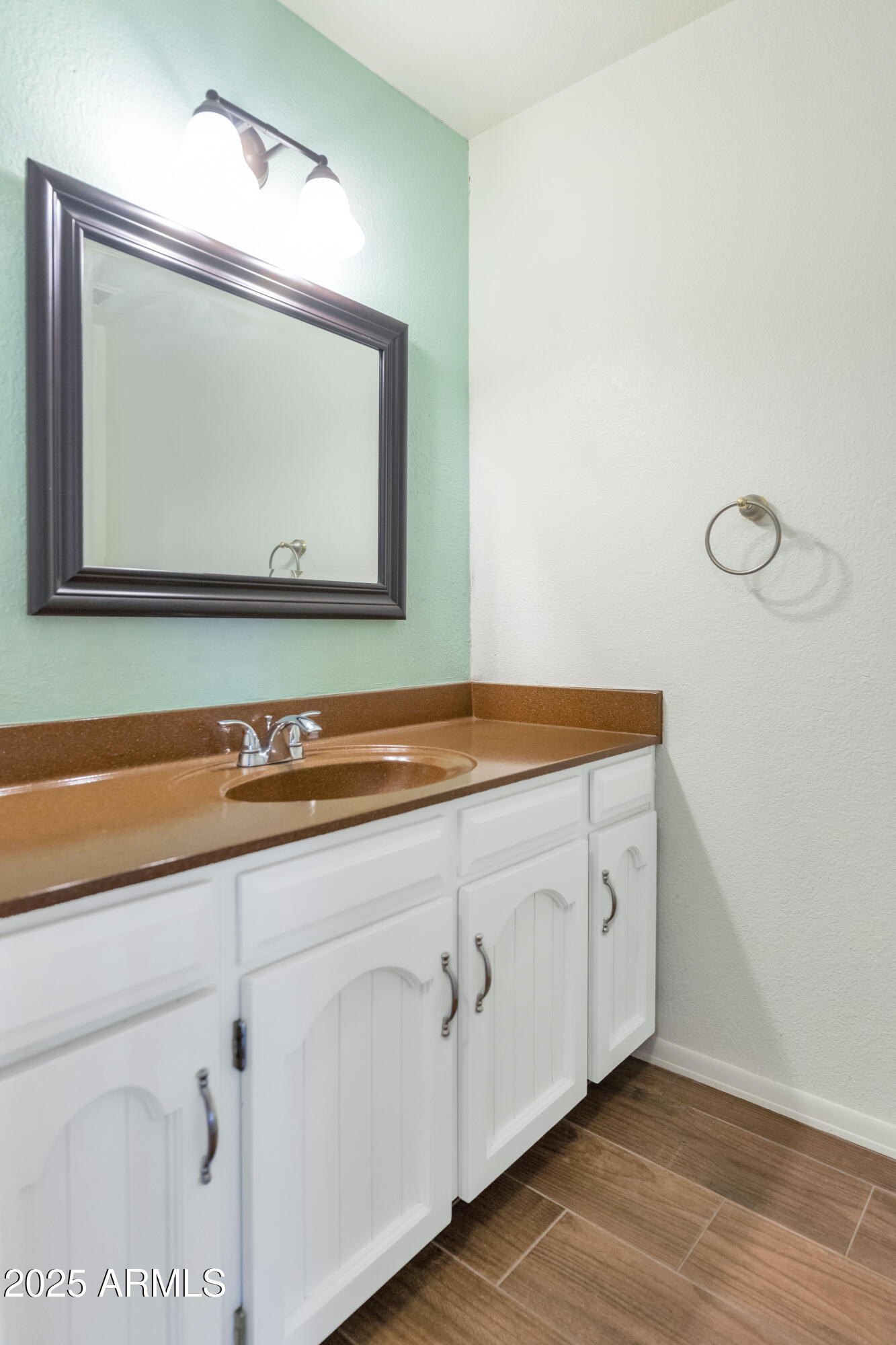 5726 North 10th Street, Unit 5 Phoenix, AZ 85014 - Photo 31 of 39 a bathroom with a sink mirror and vanity