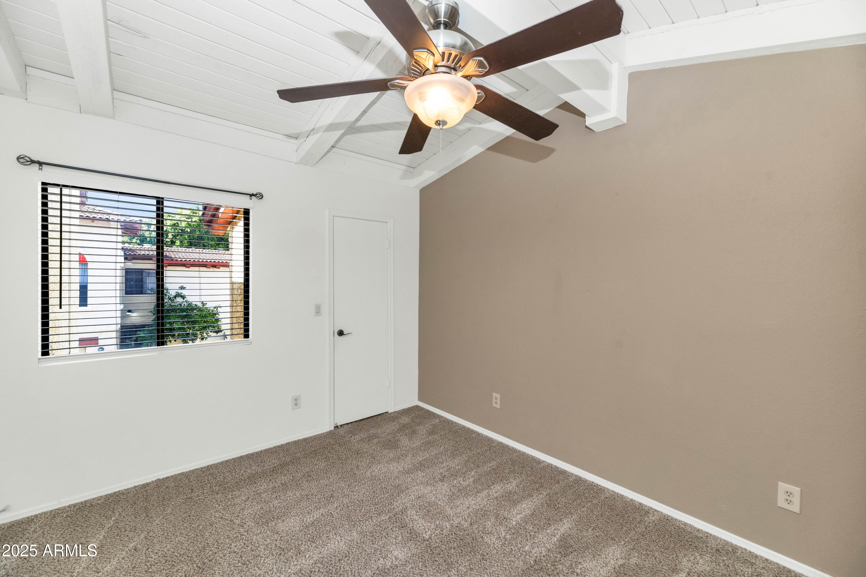 5726 North 10th Street, Unit 5 Phoenix, AZ 85014 - Photo 35 of 39 an empty room with windows and fan