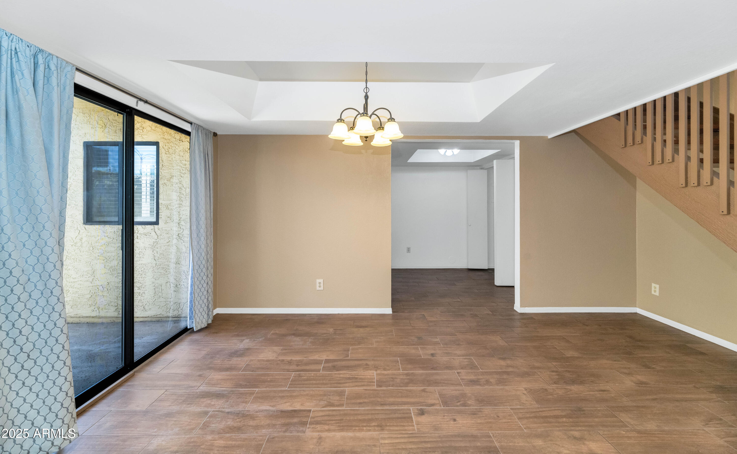 5726 North 10th Street, Unit 5 Phoenix, AZ 85014 - Photo 7 of 39 a view of a livingroom with a chandelier