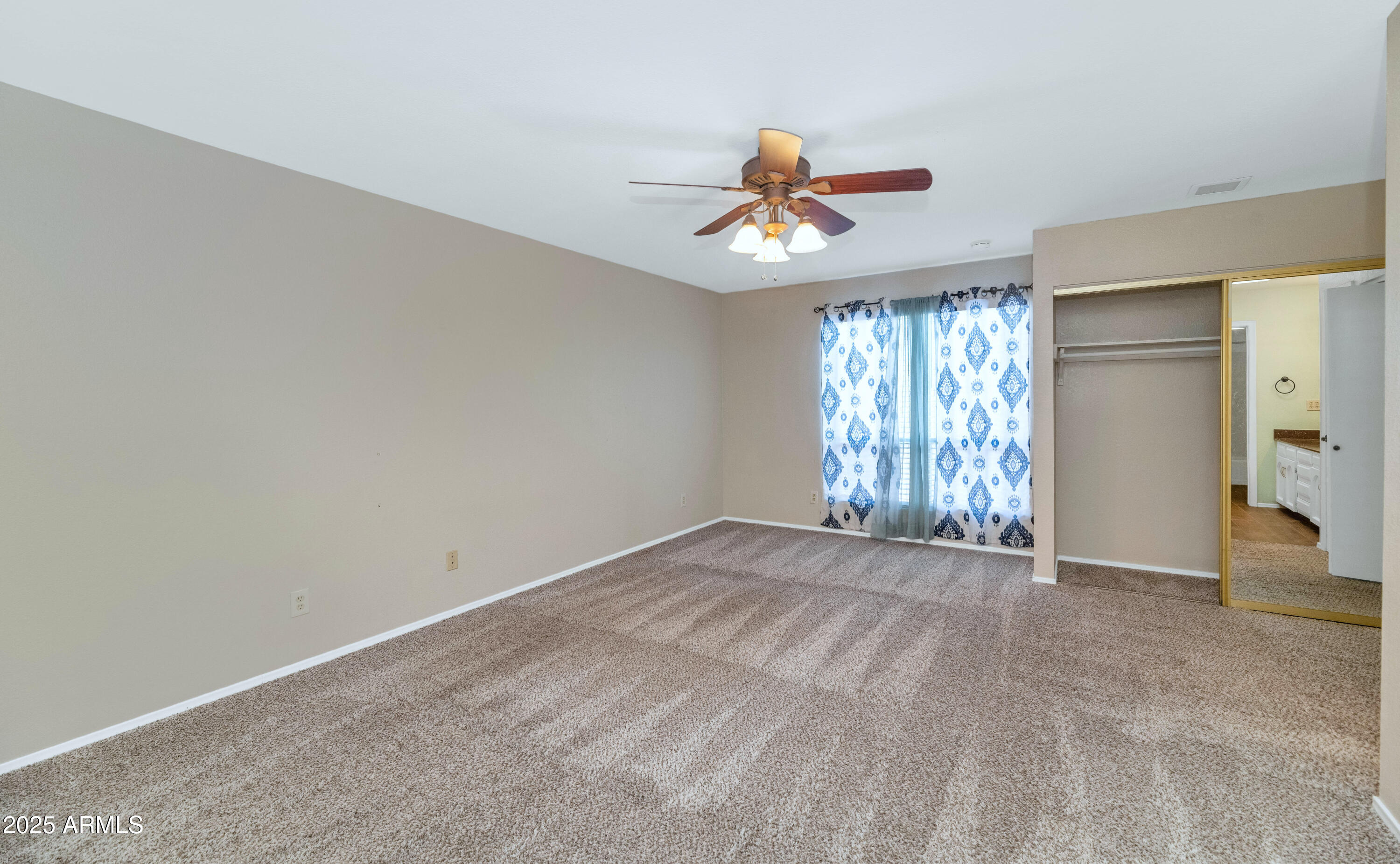 5726 North 10th Street, Unit 5 Phoenix, AZ 85014 - Photo 9 of 39 a view of an empty room with a window