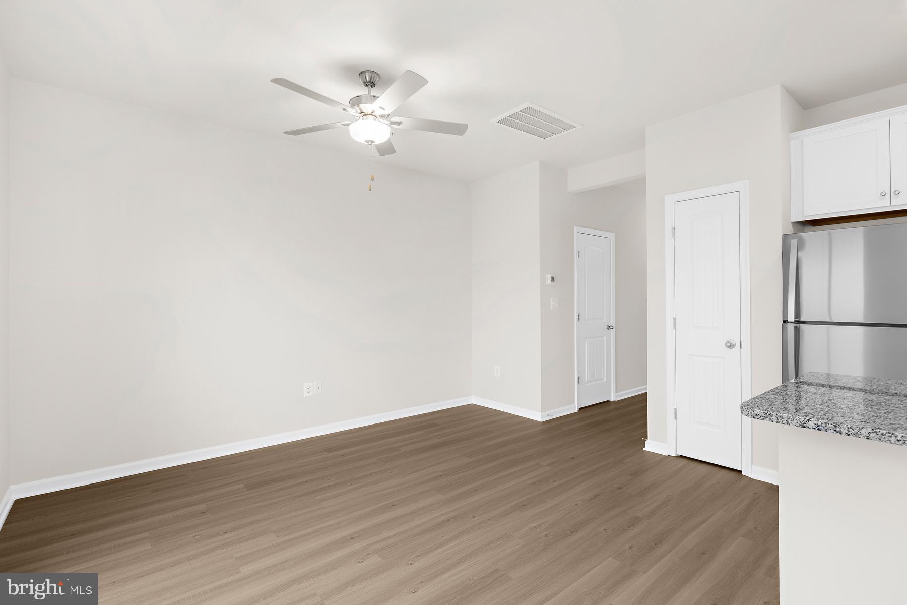 8155 Bartholomew Court Baltimore, MD 21206 - Photo 12 of 19 a view of a kitchen with wooden floor